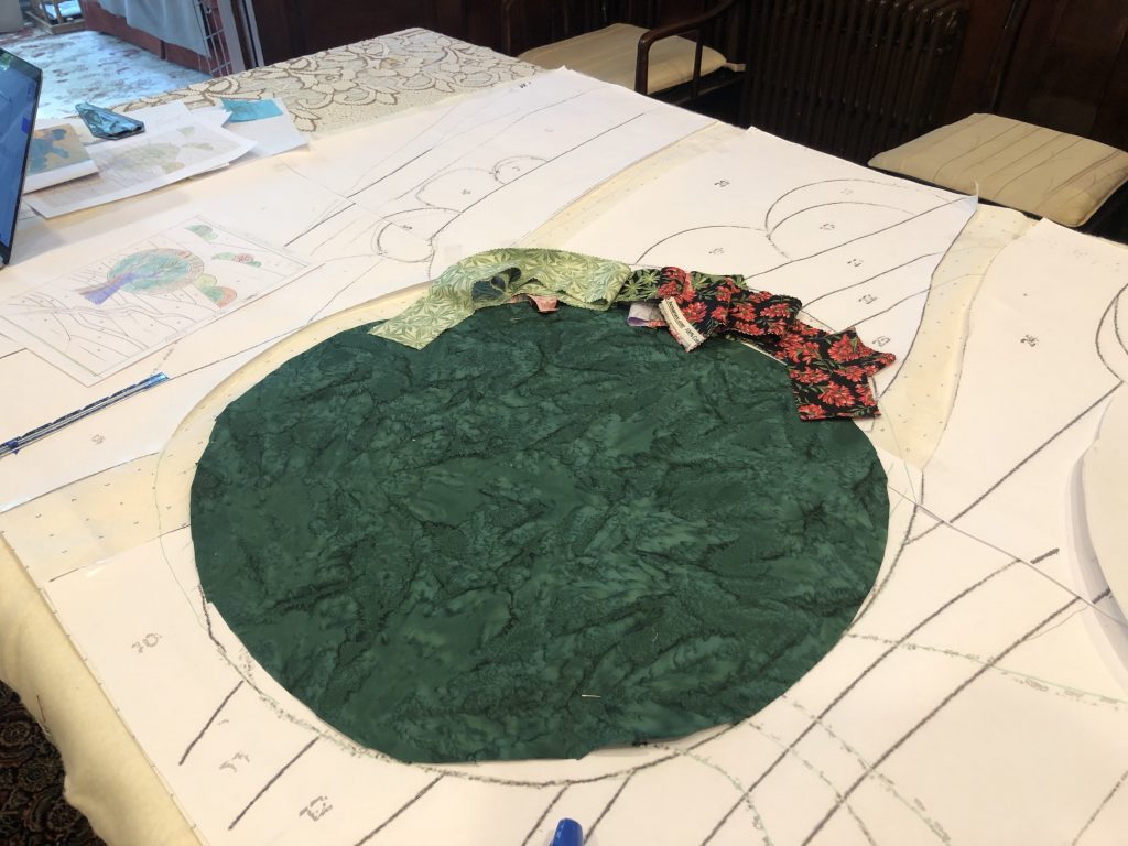 Fabric being sized over the quilt pattern