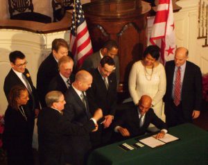 May Fenty signing the DC Marriage Equality Bill in the All Souls Sanctuary